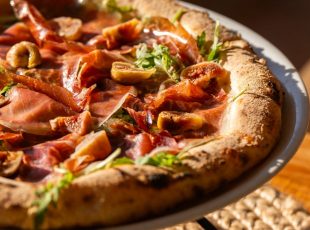 Gourmet Istrian pizza with prosciutto and figs at Villa Romana Porec